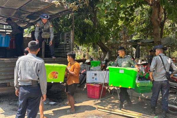 Myanmar's police rescuers carry belonging from the site of a collapsed building in the aftermath of Friday's earthquake in Naypyitaw, Myanmar, Wednesday, April 2, 2025. (AP Photo)