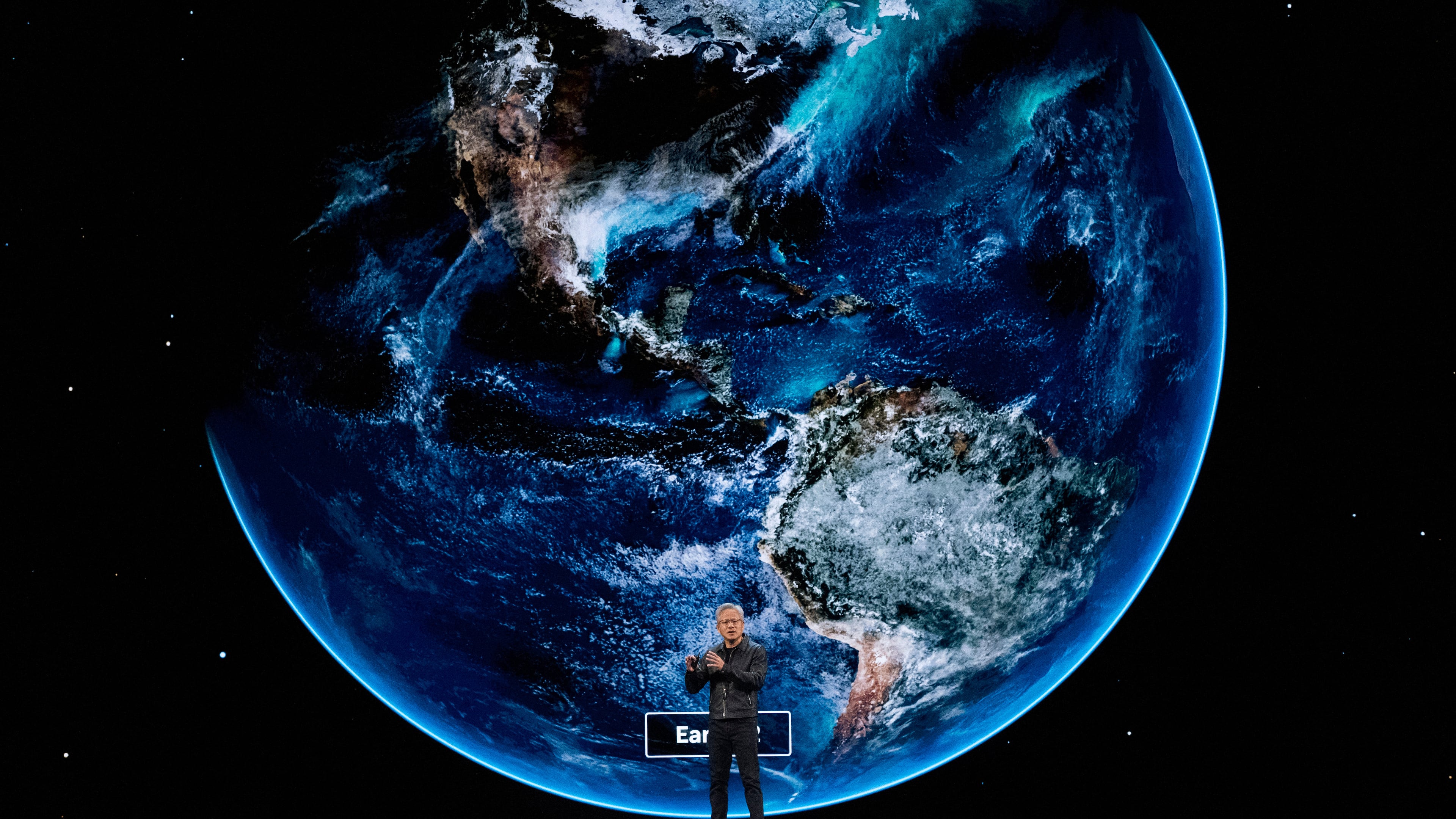 NVIDIA CEO Jensen Huang speaks on how AI infrastructure and AI factories that generate intelligence at scale are powering a new industrial revolution, at Washington Convention Center, Tuesday, Oct. 28, 2025, in Washington. (AP Photo/Manuel Balce Ceneta)