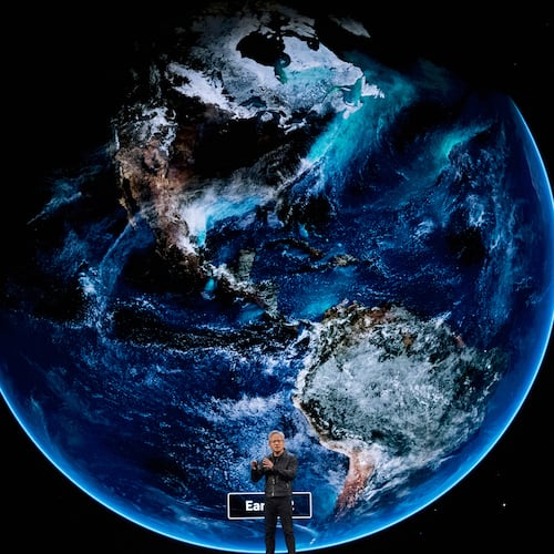 NVIDIA CEO Jensen Huang speaks on how AI infrastructure and AI factories that generate intelligence at scale are powering a new industrial revolution, at Washington Convention Center, Tuesday, Oct. 28, 2025, in Washington. (AP Photo/Manuel Balce Ceneta)