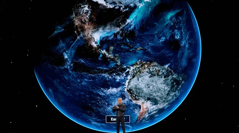 NVIDIA CEO Jensen Huang speaks on how AI infrastructure and AI factories that generate intelligence at scale are powering a new industrial revolution, at Washington Convention Center, Tuesday, Oct. 28, 2025, in Washington. (AP Photo/Manuel Balce Ceneta)