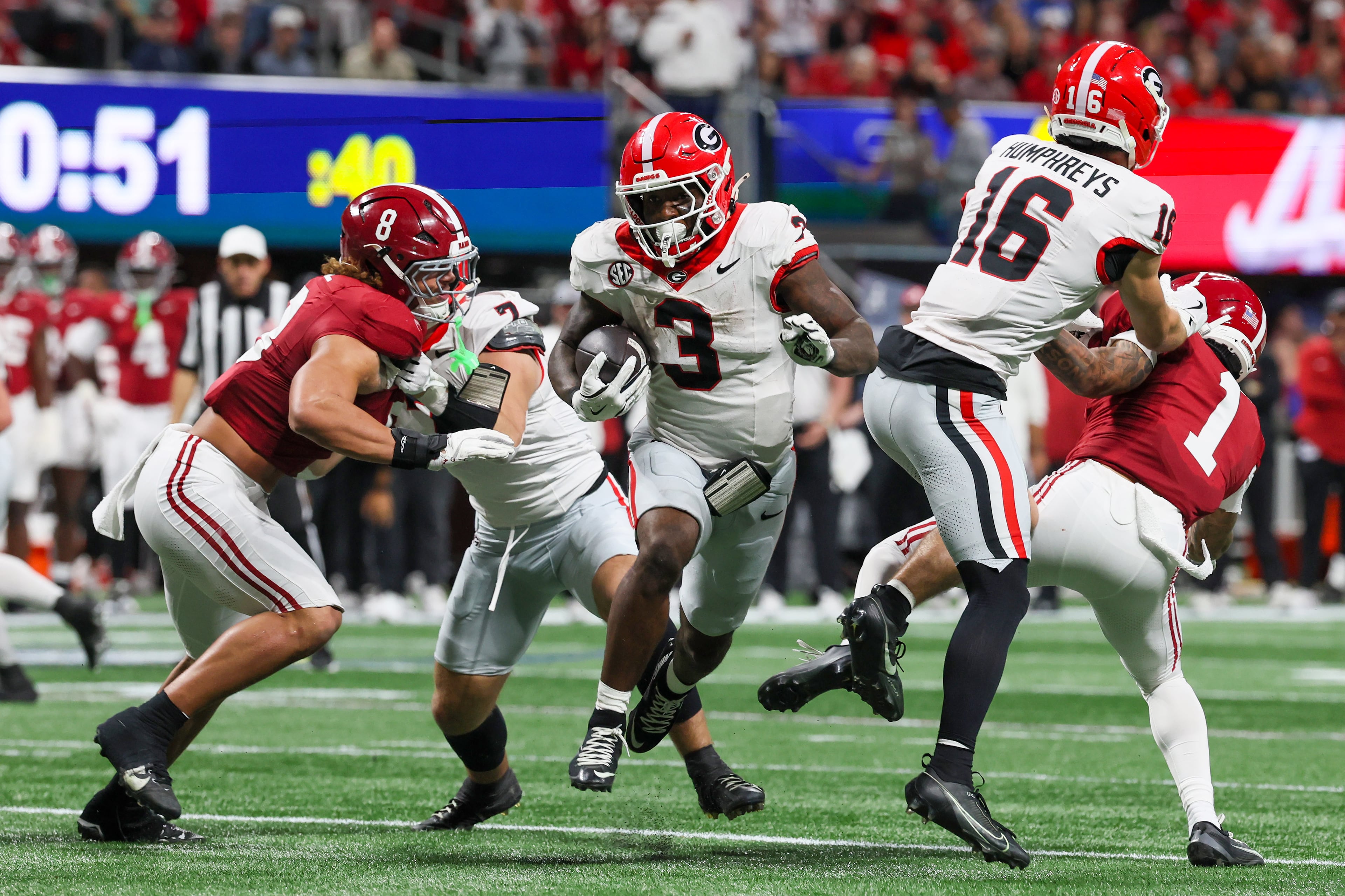 Georgia running back Nate Frazier (3) rushes for a nine yard touchdown against Alabama during the third quarter of the SEC Championship game at Mercedes-Benz Stadium, Saturday, Dec. 6, 2025, in Atlanta. (Jason Getz / AJC)