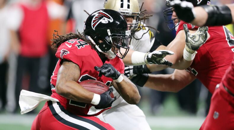 Falcons running back Devonta Freeman gains five yards on this run against the Saints on Thursday night.