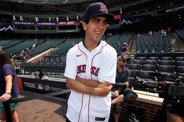 FILE - Boston Red Sox first round draft pick Marcelo Mayer watches batting practice for the MLB All-Star baseball game, Monday, July 12, 2021, in Denver. (AP Photo/David Zalubowski,File)
