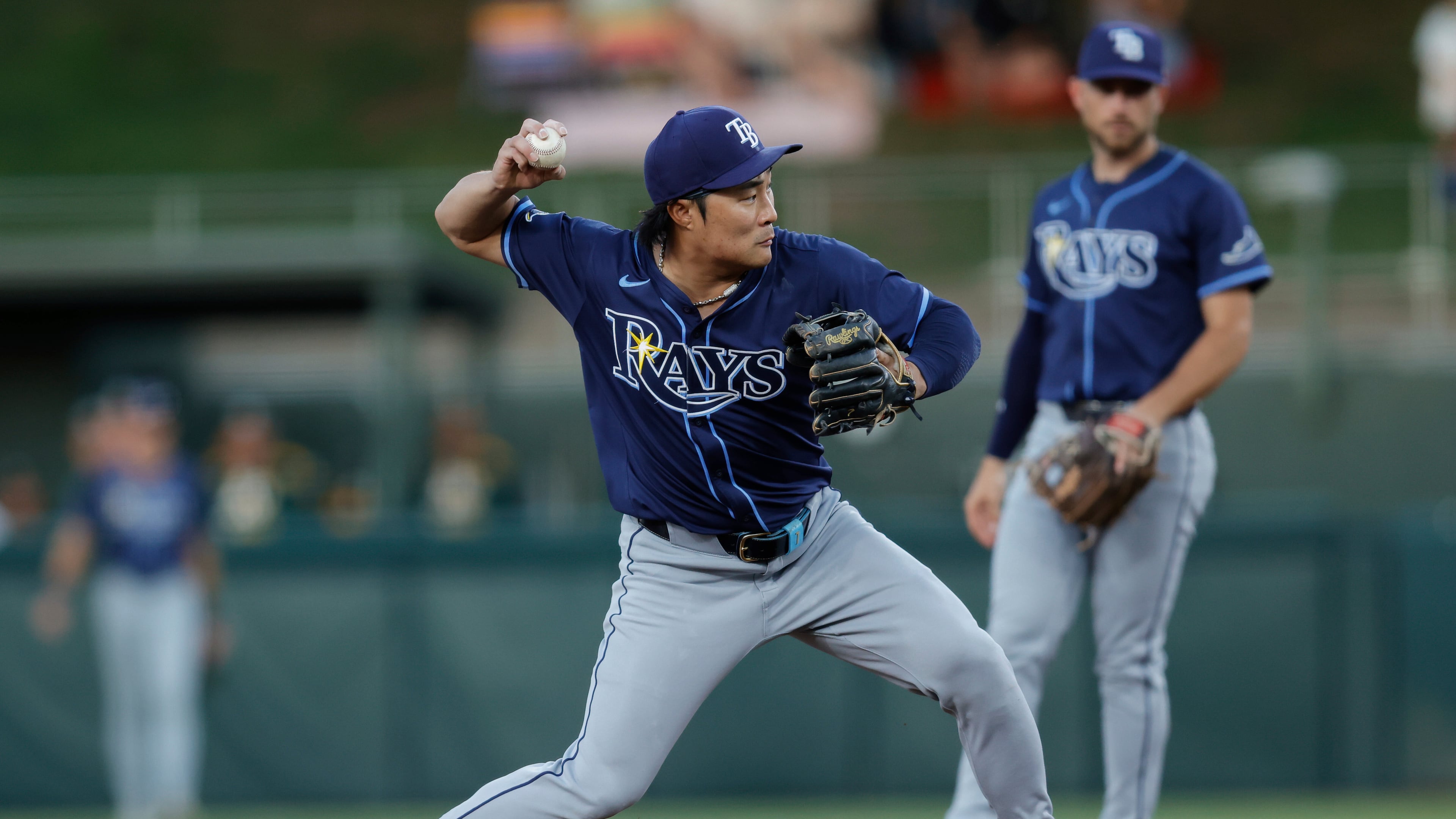 Tampa Bay Rays shortstop Ha-Seong Kim, left, throws to first base for a double play during the second inning of a baseball game against the Athletics, Monday, Aug. 11, 2025, in West Sacramento, Calif. (Sergio Estrada/AP)