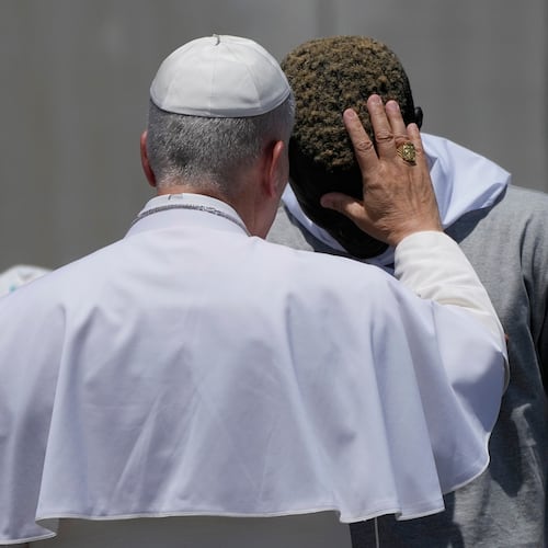 Pope Leo XIV blesses a migrant during a meeting with organisations working with migrants in Arguineguin at the Canary Islands, Spain, Thursday, June 11, 2026. (AP Photo/Alessandra Tarantino)