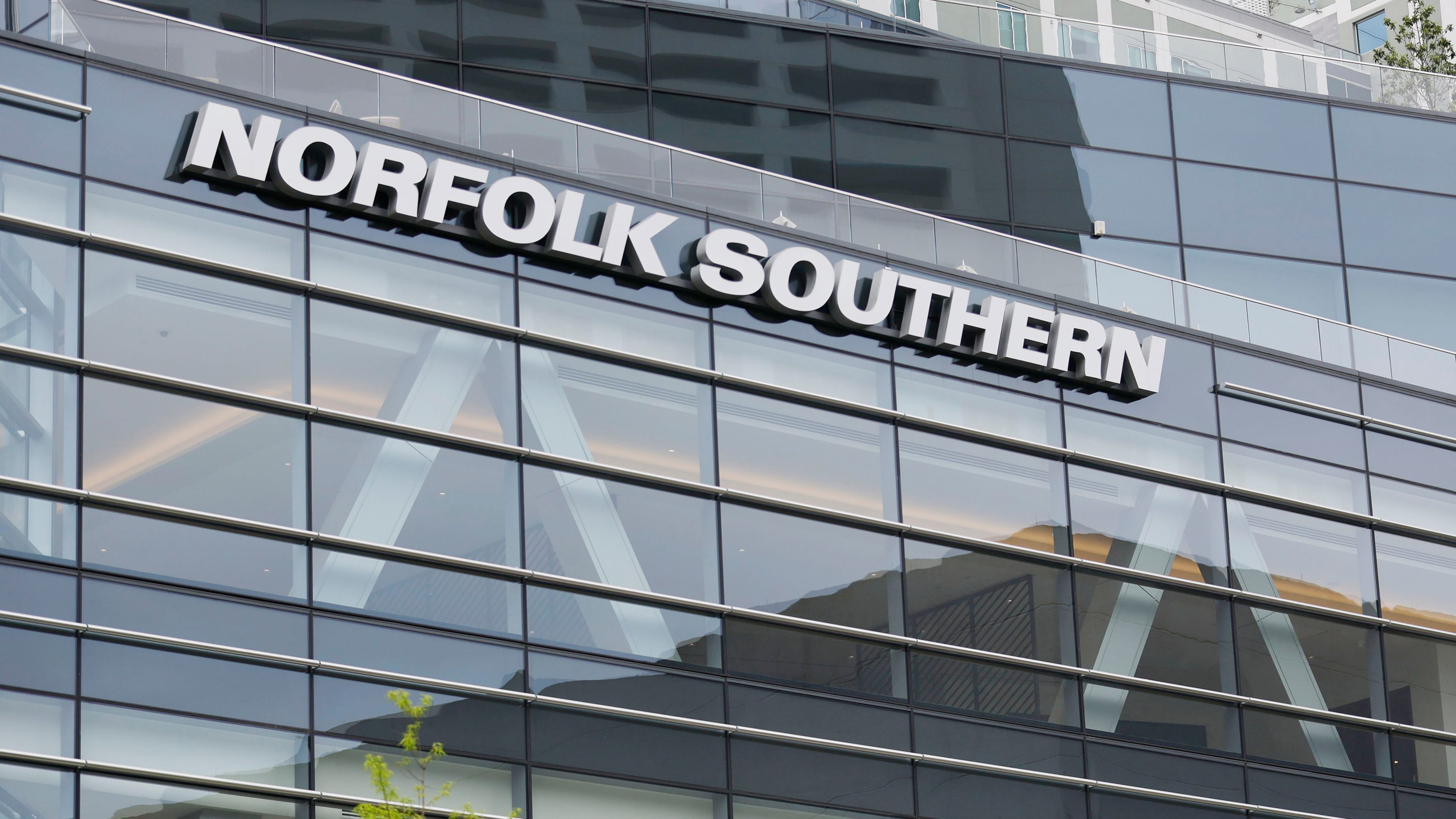 The Norfolk Southern logo is prominently displayed on the company's headquarters in Atlanta. The potential downsizing to come has neighborhood stakeholders holding their breath. (Miguel Martinez/AJC 2023)
