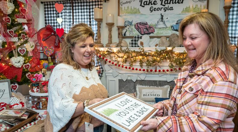 Ginger Pigg (left) works with Amy Boone at The Perfect Pigg in Cumming. Ginger opened up her gift shop near Lake Lanier in March 2020. She was open for three days before the initial COVID shutdown. Starting a new business has come with many struggles, but she loves this newfound career and is grateful for the support of her community.  PHIL SKINNER FOR THE ATLANTA JOURNAL-CONSTITUTION.