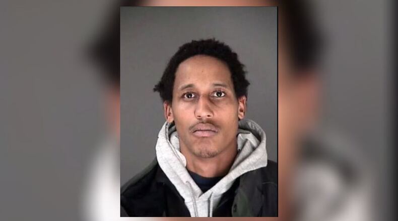 Deiontre Hughes, 28, was taken into custody in downtown Atlanta on a murder charge in connection with a killing that happened weeks earlier in the same area, police said.