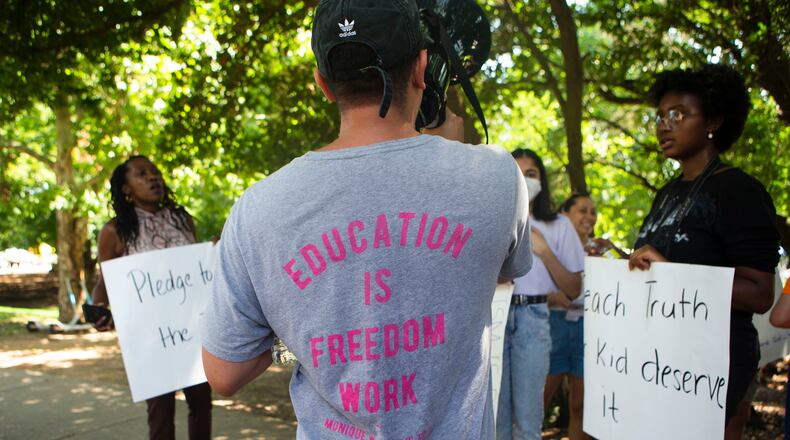Jonathan Peraza-Campos, a local educator, speaks during a back-to-school rally for Georgia educators on Saturday, July 23, 2022, at Piedmont Park in Atlanta. Teachers, community members and students gathered to speak against new state legislative action banning selected books from school libraries and prohibiting the teaching of divisive concepts in U.S. History. (Christina Matacotta for The Atlanta Journal-Constitution)