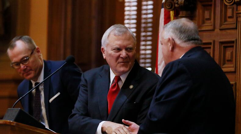Gov. Nathan Deal shakes hand with Speaker David Ralston (right) and Lt. Gov. Casey Cagle following his State of the State address for 2017 before a joint session of the General Assembly. BOB ANDRES /BANDRES@AJC.COM