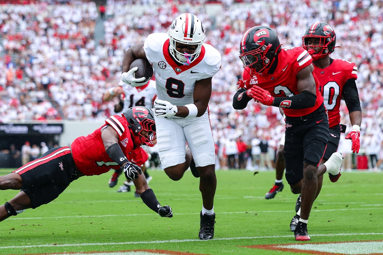 Georgia tight end Ethan Barbour (center) scores a touchdown against Western Kentucky defensive backs Jaylen Lewis (left) and Christian White during the first half of an NCAA football game, Saturday, Sept. 12, 2026, in Athens. (Colin Hubbard/AP)