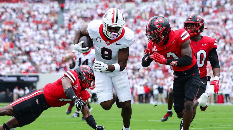 Georgia tight end Ethan Barbour (center) scores a touchdown against Western Kentucky defensive backs Jaylen Lewis (left) and Christian White during the first half of an NCAA football game, Saturday, Sept. 12, 2026, in Athens. (Colin Hubbard/AP)
