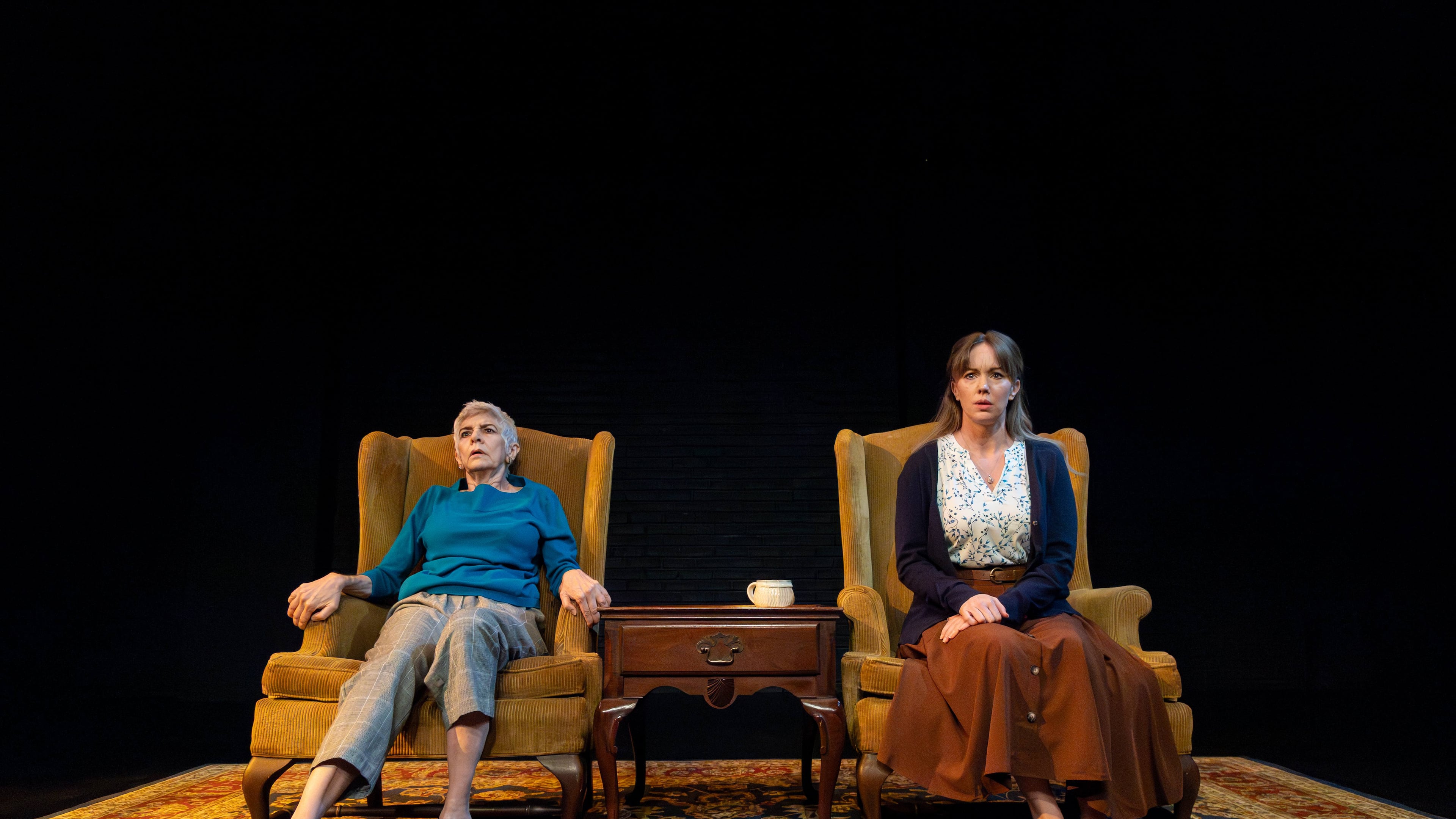 Mary Lynn Owen (left) as the mentalist Linda appears ready to bolt while keeping company with traumatized Hilda (Bethany Anne Lind) in "The Thin Place" at Actor's Express. (Photo by Casey Gardner Ford)