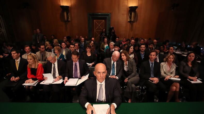 WASHINGTON, DC - OCTOBER 04: Former Equifax CEO Richard Smith prepares to testify before the Senate Banking, Housing and Urban Affairs Committee. Smith stepped down as CEO of Equifax last week after it was reported that hackers broke into the credit reporting agency and made off with the personal information of more than 145 million Americans. (Photo by Mark Wilson/Getty Images)