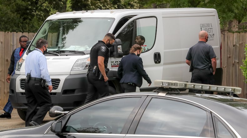 April 15, 2021 DeKalb County: A funeral home van pulls up to the residence that was the focus of a police SWAT operation to transport the deceased from the home. Residents in a DeKalb County neighborhood were evacuated Thursday morning, April 15, 2021 while a SWAT team negotiated with a man barricaded inside a home. Police were called to the 1200 block of Sherrington Drive about 4:15 a.m. after the man began attacking his relatives, according to DeKalb police spokeswoman Michaela Vincent. The SWAT team was activated when the man refused to come out, she said. It was unclear if he was armed, or if anyone inside the home was injured. The SWAT team stood down shortly before 9:30 a.m., clearing the way for police investigators to enter the residence. Authorities removed a body from the home shortly before 10:30 a.m. Parts of Sherrington Drive were closed, and residents near the home were evacuated, Vincent said. There was a large police presence in the neighborhood, which is located off Redan and South Hairston roads. (John Spink / John.Spink@ajc.com)