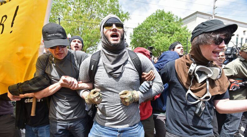 Anti-racist protesters at a National Socialist Movement rally in downtown Newnan last April. HYOSUB SHIN / HSHIN@AJC.COM