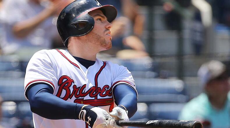Braves frist baseman Freddie Freeman hits a solo homer - his 11th of the season - to give the Braves a 2-1 lead over the Padres in the sixth inning Thursday in Atlanta.