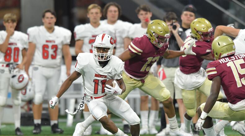 North Gwinnett wide receiver Josh Downs (11) makes a move after a catch in the second half of the Corky Kell Classic   Saturday, Aug. 18, 2018, at Mercedes-Benz Stadium in Atlanta. North Gwinnett won, 37-2, over Brookwood.