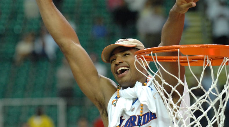 Florida's Al Horford celebrates after cutting part of the net after his team's victory in the NCAA final at the Georgia Dome on Aopril 2, 2007. (Rich Addicks / AJC file photo)