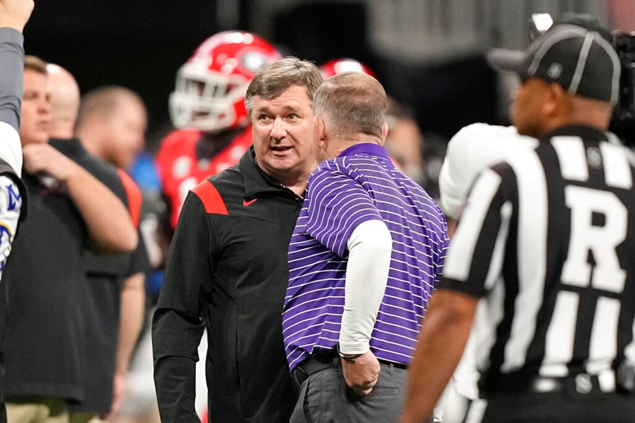 LSU head coach Brian Kelly and Georgia head coach Kirby Smart meet before the Southeastern Conference championship NCAA college football game, Saturday, Dec. 3, 2022, in Atlanta. (Brynn Anderson/AP)