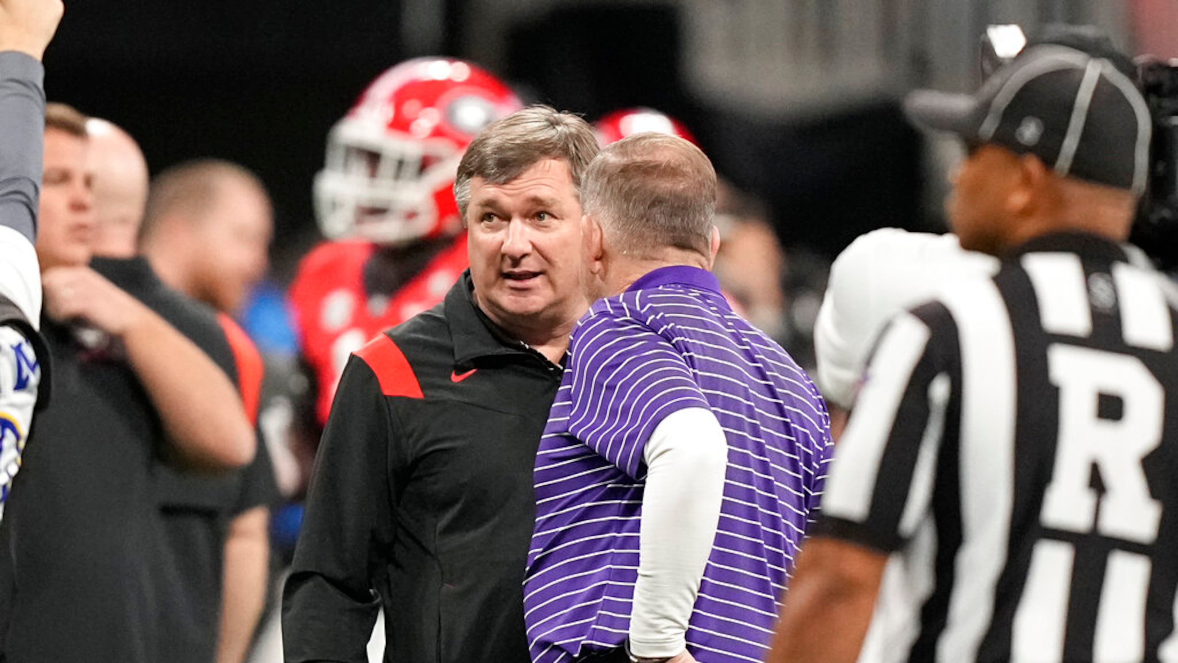 LSU head coach Brian Kelly and Georgia head coach Kirby Smart meet before the Southeastern Conference championship NCAA college football game, Saturday, Dec. 3, 2022, in Atlanta. (Brynn Anderson/AP)