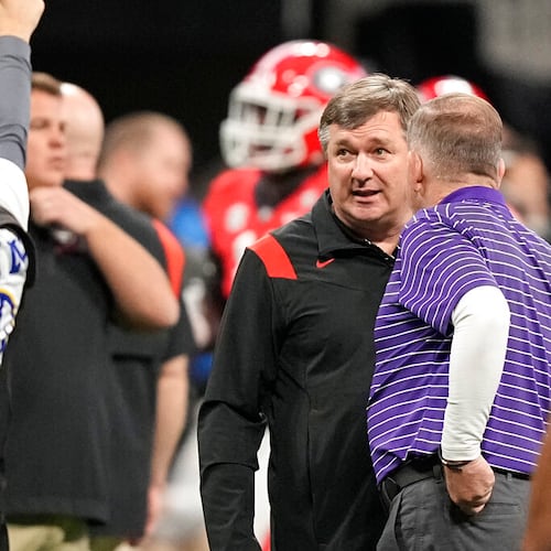 LSU head coach Brian Kelly and Georgia head coach Kirby Smart meet before the Southeastern Conference championship NCAA college football game, Saturday, Dec. 3, 2022, in Atlanta. (Brynn Anderson/AP)