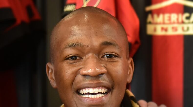 December 15, 2017 Atlanta - New Atlanta United midfielder Darlington Nagbe (background left) is welcomed by fans at the Team Store at Mercedes-Benz Stadium on Friday, December  on Friday, December 15, 2017. Atlanta United introduced midfielder Darlington Nagbe to the media on Friday at Mercedes-Benz Stadium. Hyosub Shin / hshin@ajc.com