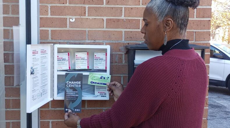 Change Center Director Alesha Burgman displays contents of the first of two Opioid Aid Kits to be located in Albany. The boxes can be accessed at all times and provide Narcan and other supplies needed to aid an individual experiencing an opioid overdose. (Photo Courtesy of Alan Mauldin)