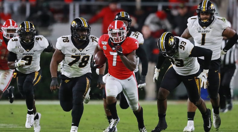 Georgia tailback D’Andre Swift makes a long gain for a first down against Missouri during the third quarter in an NCAA college football game on Nov. 9, 2019, in Athens. CURTIS COMPTON / CCOMPTON@AJC.COM