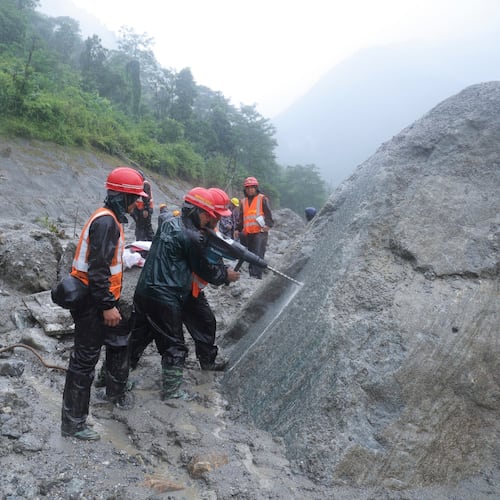 This photo provided by the Nepal Army, shows Nepal army soldiers using a drilling machine during a rescue operation at the site of a hydropower project in Upper Trishuli, Nepal, Sunday, Aug. 30, 2026. (Nepal Army via AP)