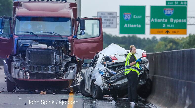 One person was killed early Wednesday in a tractor-trailer crash on I-20 West in Fulton County. JOHN SPINK / JSPINK@AJC.COM