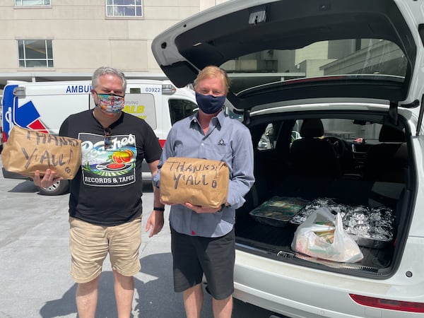 Hal Boyd and James Street deliver their barbecue to hospital workers. Courtesy of Hal Boyd