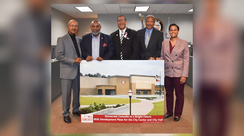 The Stonecrest mayor and City Council pose with a rendering of the old Sam's Club building, which is expected to become the new City Hall facility.