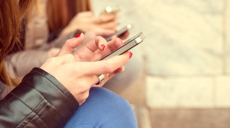 Phones have become so embedded in our lives that checking email or Twitter or baseball scores has become a habit. If you have any doubt about how addicted you are to your phone, try leaving it at home one day. (Fotolia/TNS)