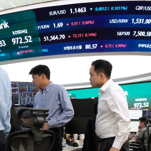 Currency traders work at the foreign exchange dealing room of the Hana Bank headquarters in Seoul, South Korea, Monday, June 22, 2026. (AP Photo/Ahn Young-joon)