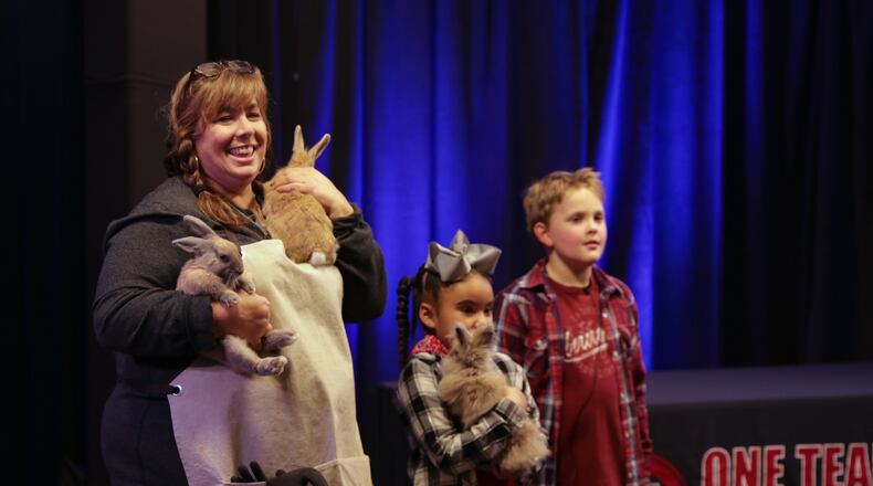 Bunnies Peter, Paul and Harry help Baker Elementary School teacher Kimberly Hutcheson receive $10,000 for her school’s outdoor LIFE lab. (Courtesy of Cobb County School District)