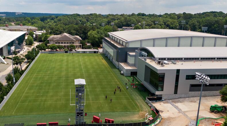 June 11, 2021 Athens - Aerial photo shows University of GeorgiaÕs Indoor Athletic Facility and new $80 million football operations building (right) on Friday, June 11, 2021. The UGAÕs athletic department simply is committed to too many other facility projects that have precedence at the moment. Most notable is the $80 million football operations building that has been added to the Butts-Mehre complex. (Hyosub Shin / Hyosub.Shin@ajc.com)