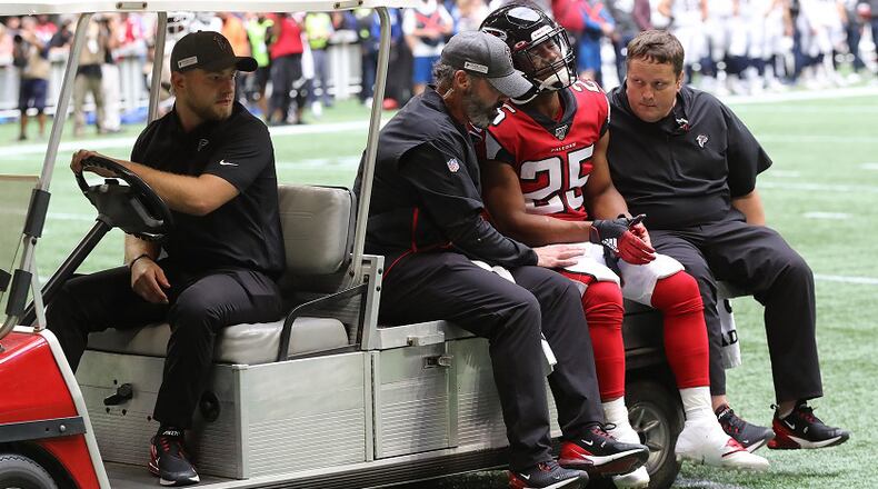 Falcons running back Ito Smith leaves the game injured during the first half against the Los Angeles Rams on Sunday, October 20, 2019, in Atlanta. Curtis Compton/ccompton@ajc.com