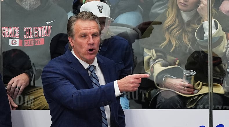 FILE - Los Angeles Kings head coach Jim Hiller directs his players from the team box in the third period of an NHL hockey game against the Colorado Avalanche Dec. 29, 2025, in Denver. (AP Photo/David Zalubowski, File)