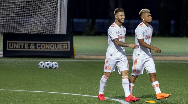 Atlanta United forward Hector Villalba (15), left, and forward Josef Martinez (7) take the field for a training session at Children?s Healthcare of Atlanta Training Ground, Thursday, Feb. 15, 2018, in Marietta, Ga. BRANDEN CAMP/SPECIAL