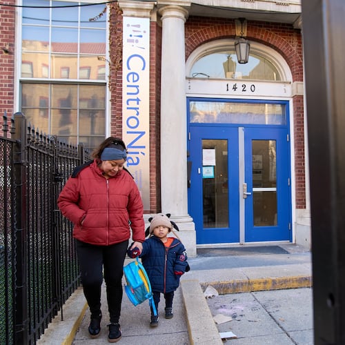 Families leave CentroNia at the end of the school day in Washington, Tuesday, Dec. 9, 2025. (AP Photo/Jacquelyn Martin)