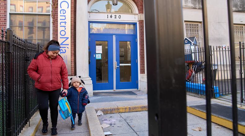 Families leave CentroNia at the end of the school day in Washington, Tuesday, Dec. 9, 2025. (AP Photo/Jacquelyn Martin)