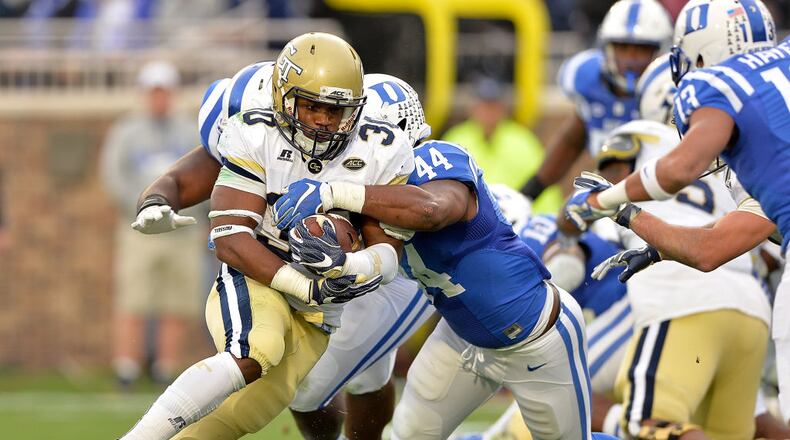Joe Giles-Harris of the Duke Blue Devils tackles KirVonte Benson of the Georgia Tech Yellow Jackets during their game at Wallace Wade Stadium on November 18, 2017 in Durham, North Carolina.  (Photo by Grant Halverson/Getty Images)