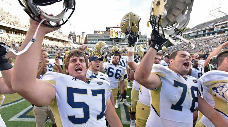 September 12, 2015 Atlanta - Georgia Tech Yellow Jackets players celebrate after defeating the Tulane Green Wave in the second half at Bobby Dodd Stadium on Saturday, September 12, 2015. Georgia Tech Yellow Jackets won 65 - 10 over the Tulane Green Wave. HYOSUB SHIN / HSHIN@AJC.COM