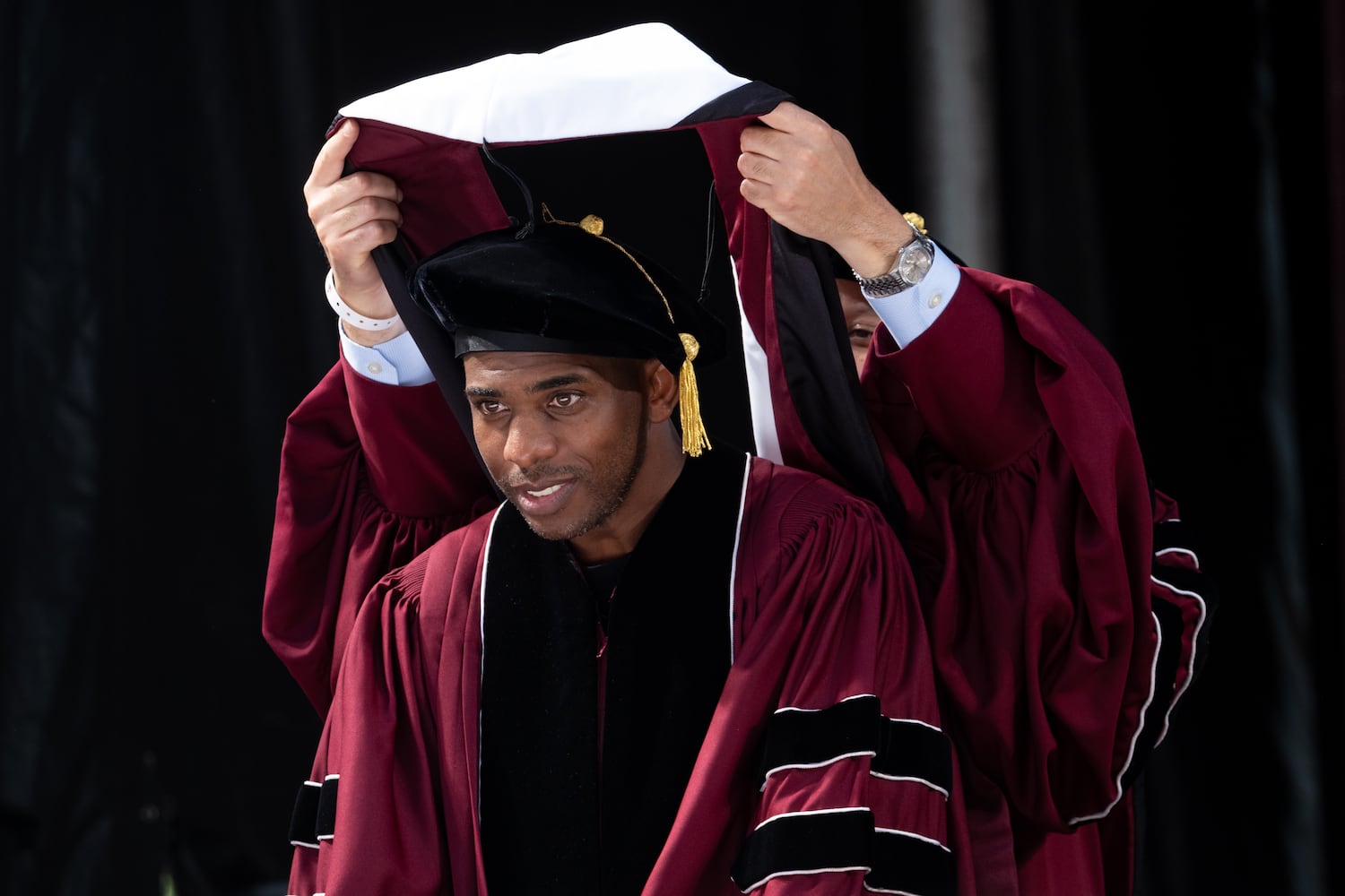 NBA All-Star Chris Paul receives an honorary Doctor of Humane Letters during Morehouse College’s graduation Sunday, May 17, 2026. Paul later delivered the commencement address. (Ben Gray for the AJC)