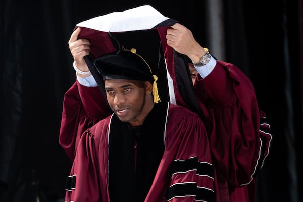NBA All-star Chris Paul receives an honorary doctor of humane letters during Morehouse College’s graduation Sunday, May 17, 2026. Paul later delivered the commencement address. (Ben Gray for the AJC)