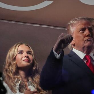 President Donald Trump gestures during the National Anthem as he attends an NBA Finals playoff basketball game between the New York Knicks and the San Antonio Spurs at Madison Square Garden in New York, Monday, June 8, 2026, with Kai Trump, left. (AP Photo/Mark Schiefelbein)