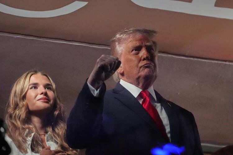 President Donald Trump gestures during the National Anthem as he attends an NBA Finals playoff basketball game between the New York Knicks and the San Antonio Spurs at Madison Square Garden in New York, Monday, June 8, 2026, with Kai Trump, left. (AP Photo/Mark Schiefelbein)