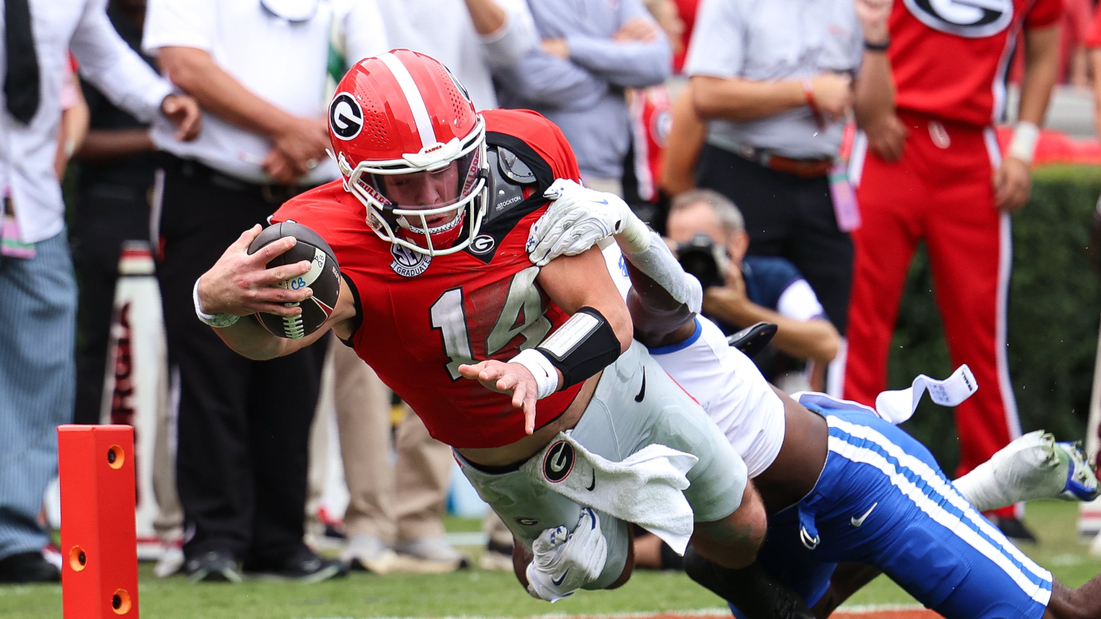 Georgia quarterback Gunner Stockton (14) dives in for a touchdown during the first half of an NCAA college football game against Kentucky, Saturday, Oct. 4, 2025, in Athens, Ga. (AP Photo/Colin Hubbard)