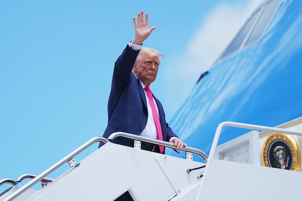 President Donald Trump gestures as he boards Air Force One, Tuesday, July 15, 2025, in Joint Base Andrews, Md. (AP Photo/Evan Vucci)